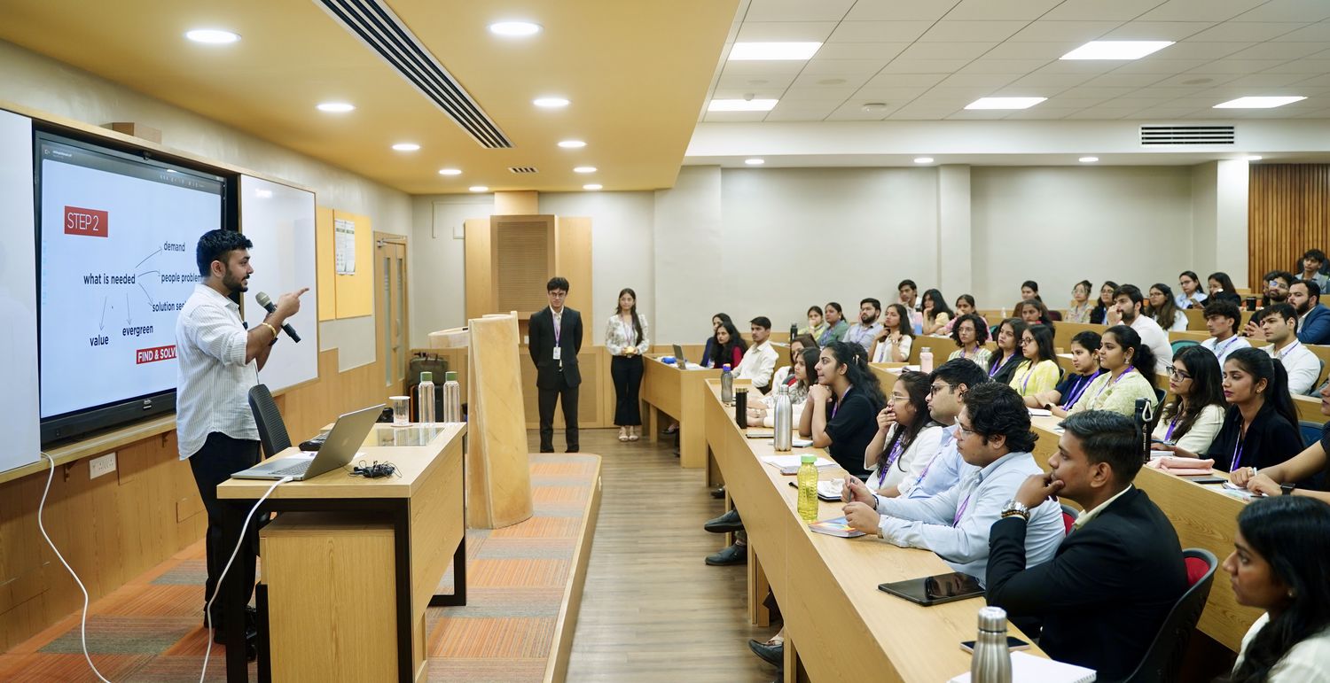 Vedant Rusty delivering to a full business-school audience